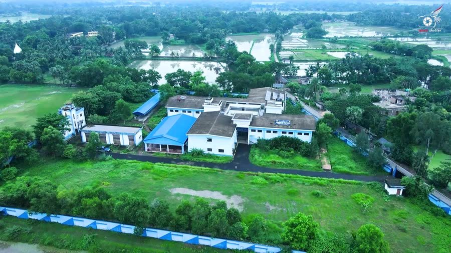 The academic and workshop blocks with the playground beyond.